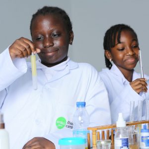 Two girls in a lab doing science experiments
